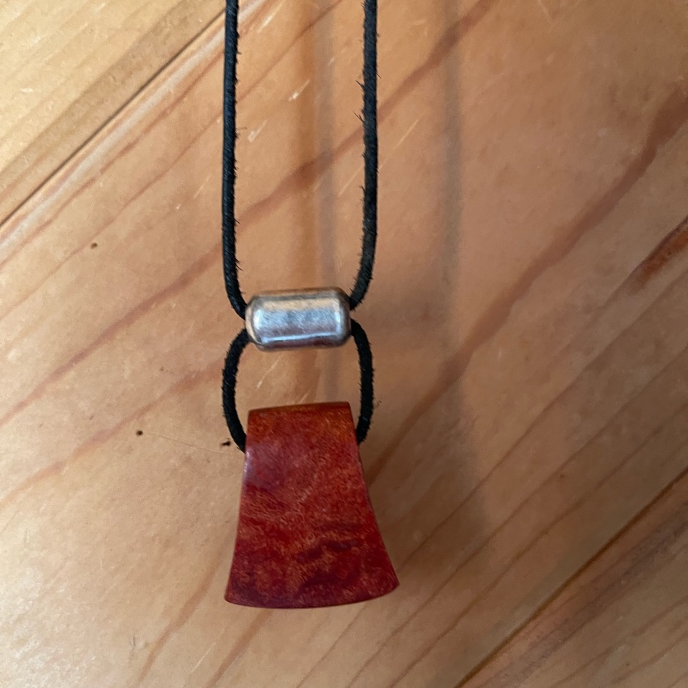 Red stone , black cord with .925 silver adjustable slider .